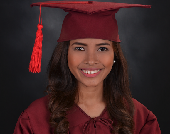 Photo by Hazel Abagao on Unsplash A woman in graduation gown and cap with red tassel.