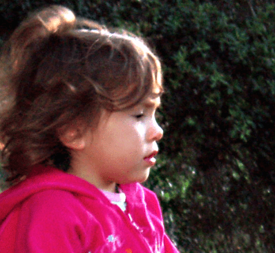 Screen Shot 2020-04-11 at 4.44.38 PM A little girl in pink jacket looking off into the distance.