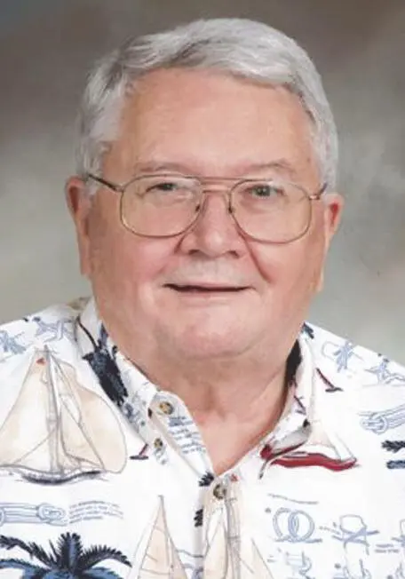 Reverend Walter Albritton A man with glasses and a hawaiian shirt.