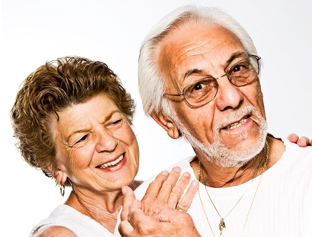 Photo-by-Marisa-Howenstine-on-Unsplash-cropped A man and woman are smiling for the camera.